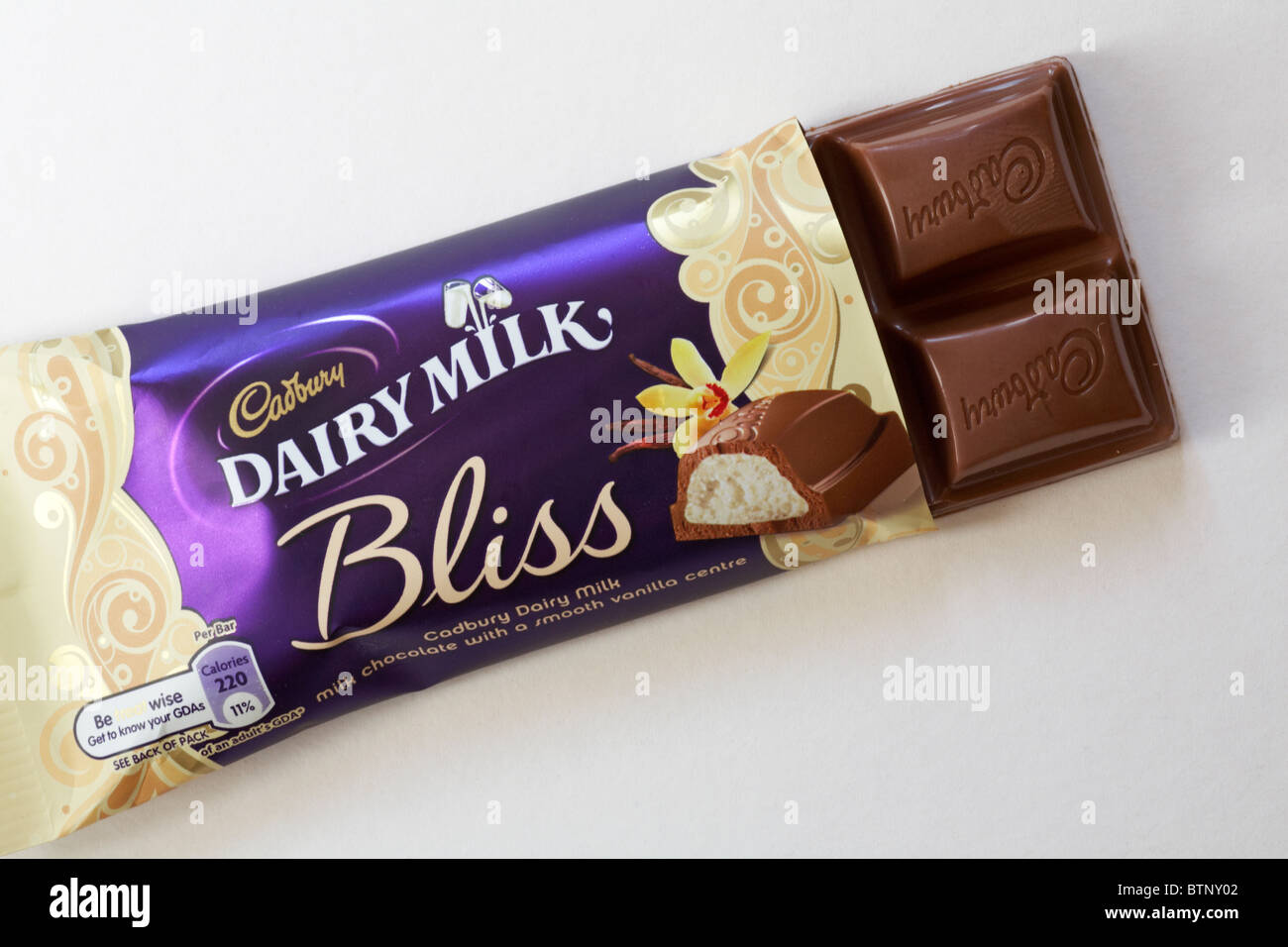 Opened bar of Cadbury Dairy Milk Bliss chocolate set on white background Stock Photo