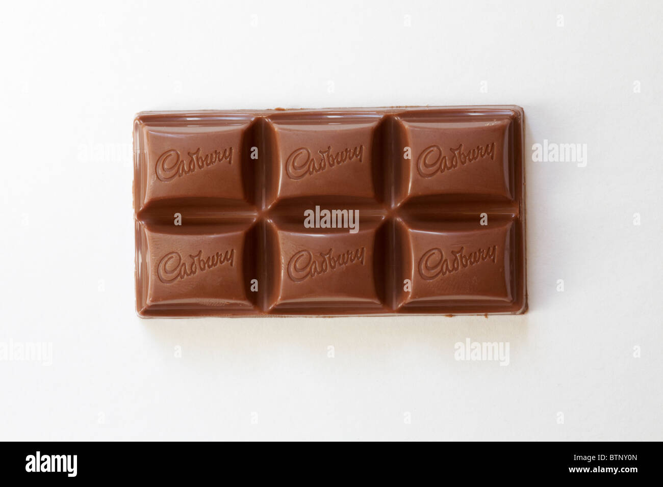 bar of Cadbury Dairy Milk Bliss chocolate out of wrapper isolated on