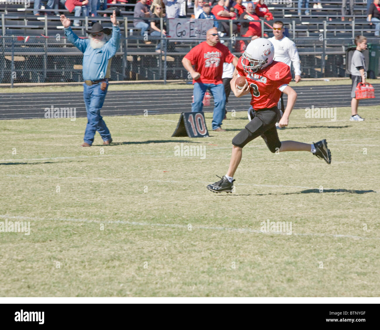 American Youth football player scoring touchdown Stock Photo