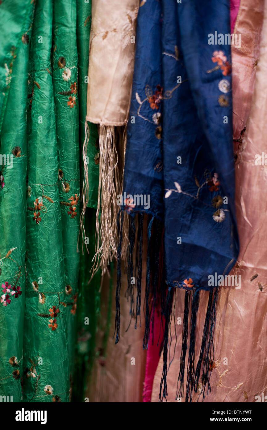 Colourful embroidered scarves hanging at the Oxford covered market. Stock Photo