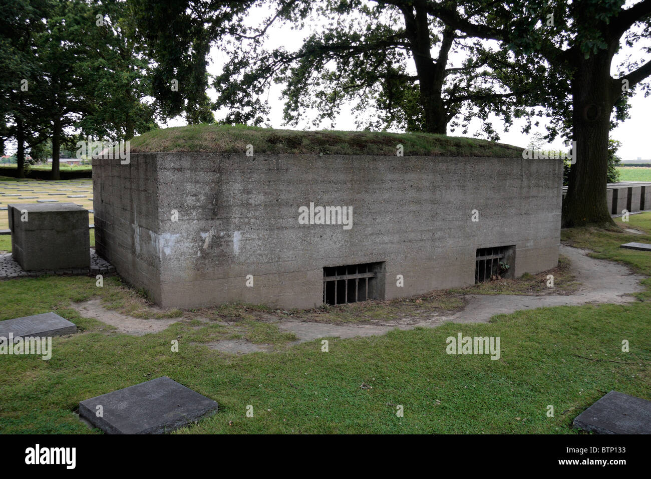 A World War One German concrete bunker in the Langemark German Cemetery, near Langemark, Belgium. Stock Photo