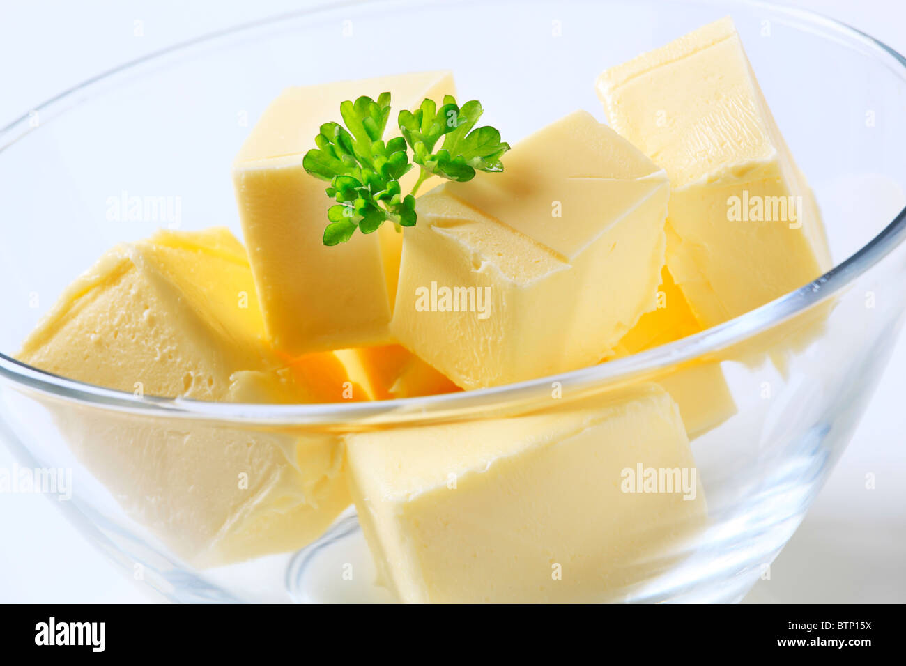 Blocks of fresh butter in a bowl Stock Photo Alamy