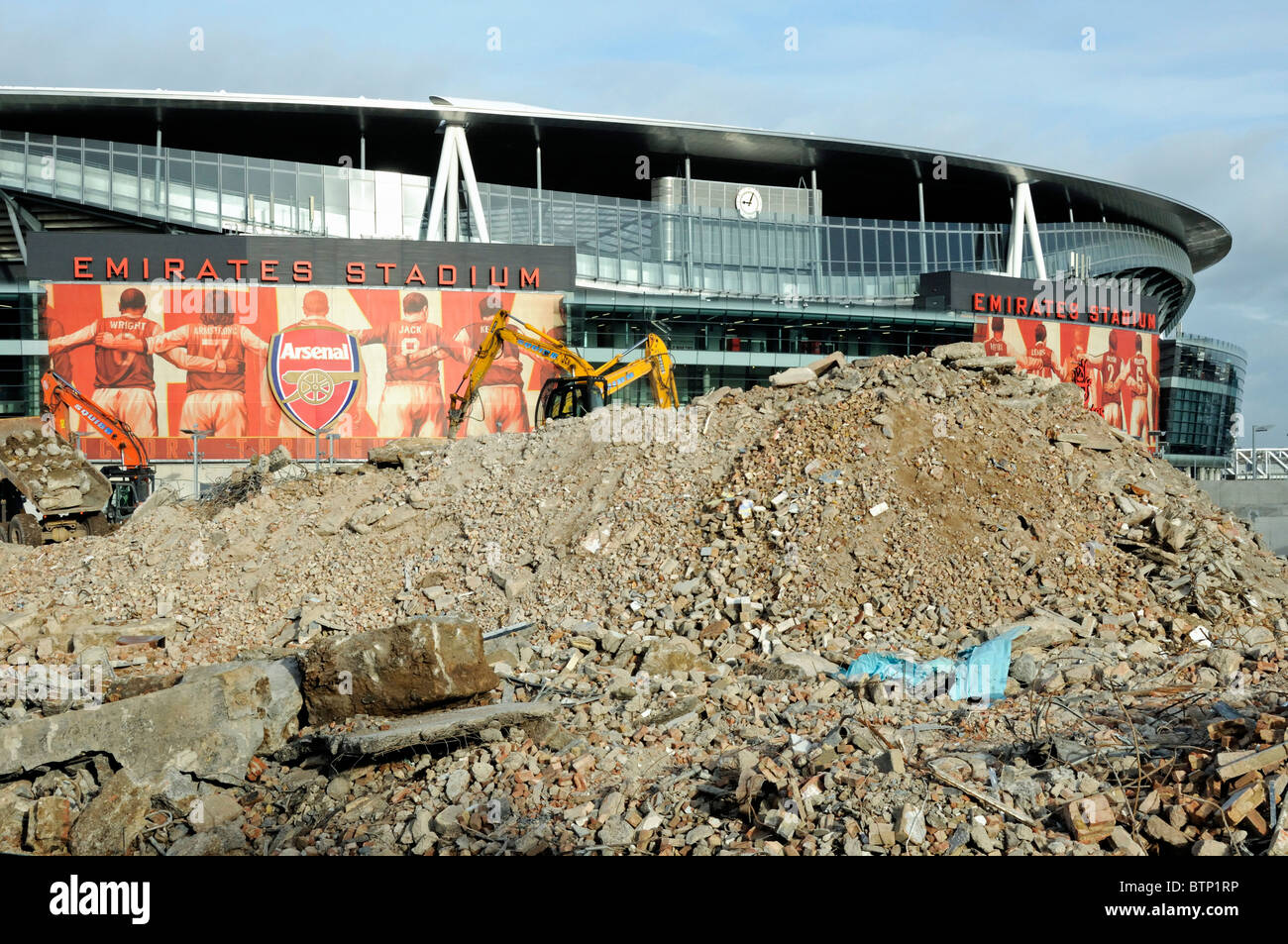 Demolition rubble in front of Arsenal Emirates Stadium, part of the Queensland Road Development Site, Holloway Islington London UK Stock Photo