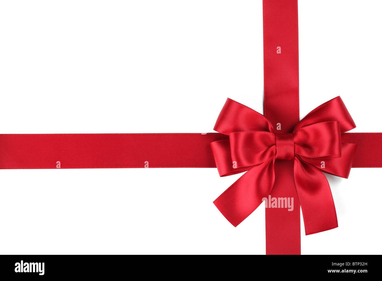 Red ribbon with bow on white Stock Photo