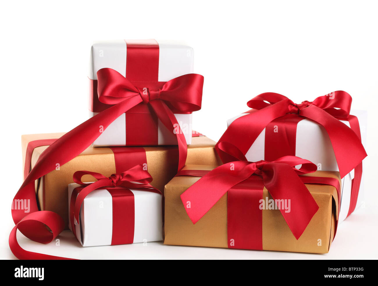 Gift boxes tied with a red satin ribbon bow. Stock Photo