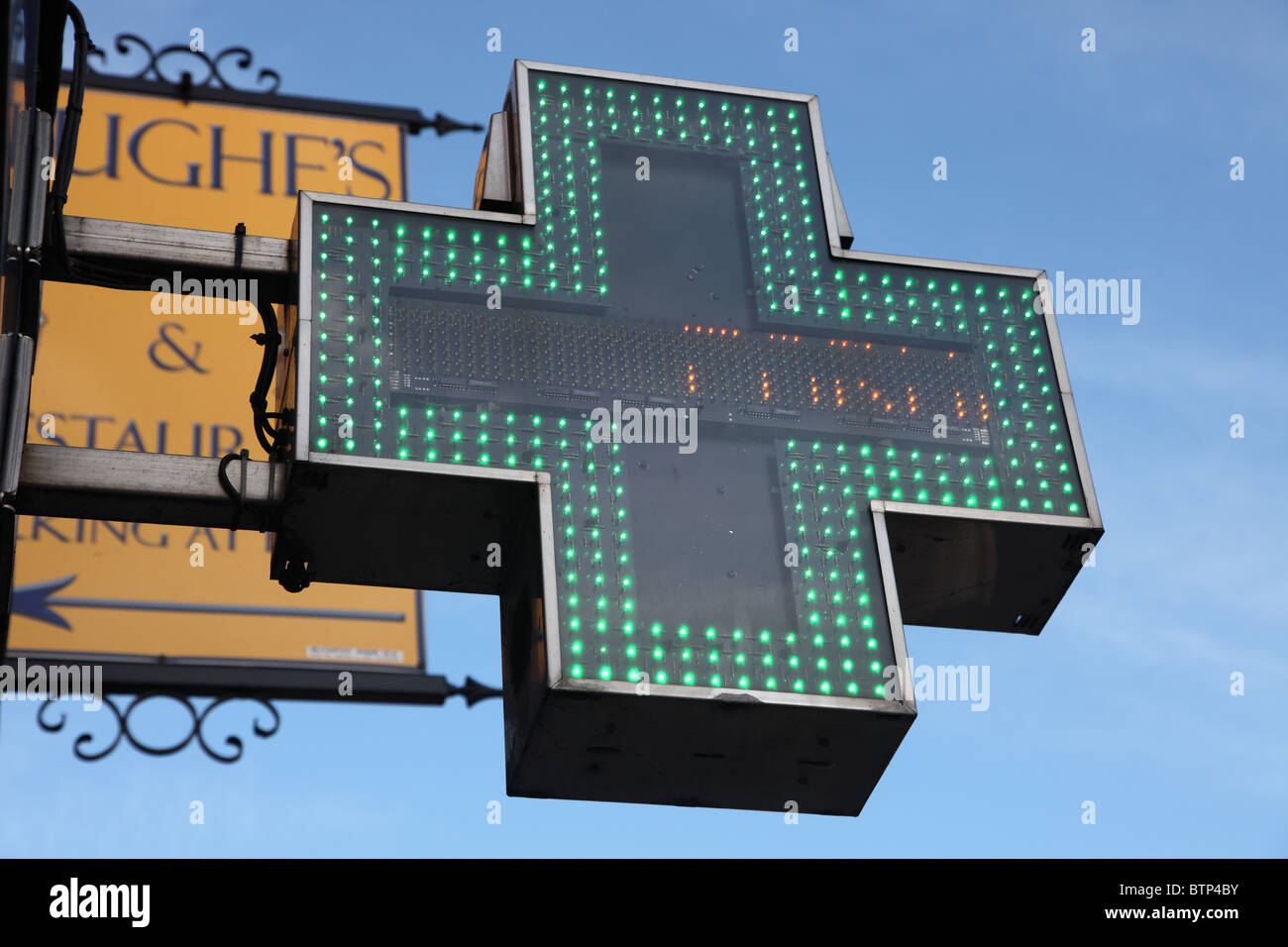 green neon cross, pharmacy symbol, Carrickmacross Stock Photo Alamy