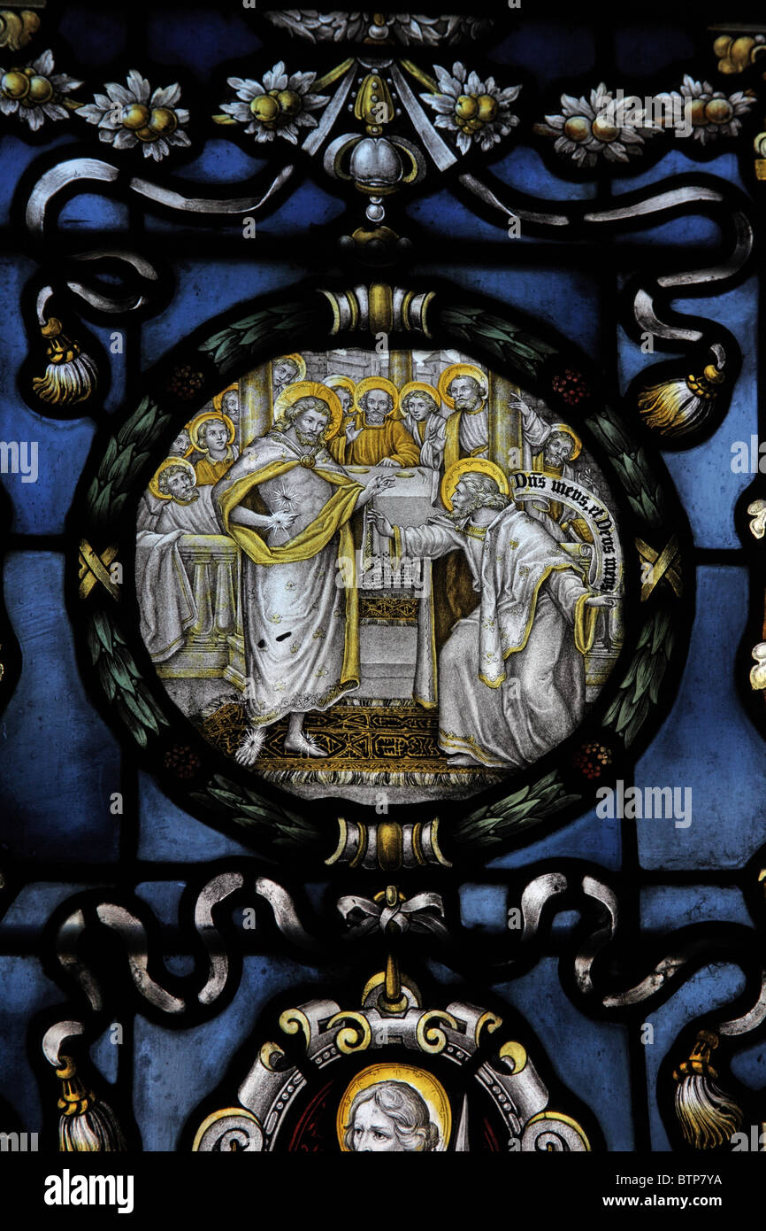 A stained glass window by C E Kempe & Co. depicting the Confession or Incredulity of St Thomas, Church of St Peter & St Paul, Longbridge Deverill Stock Photo