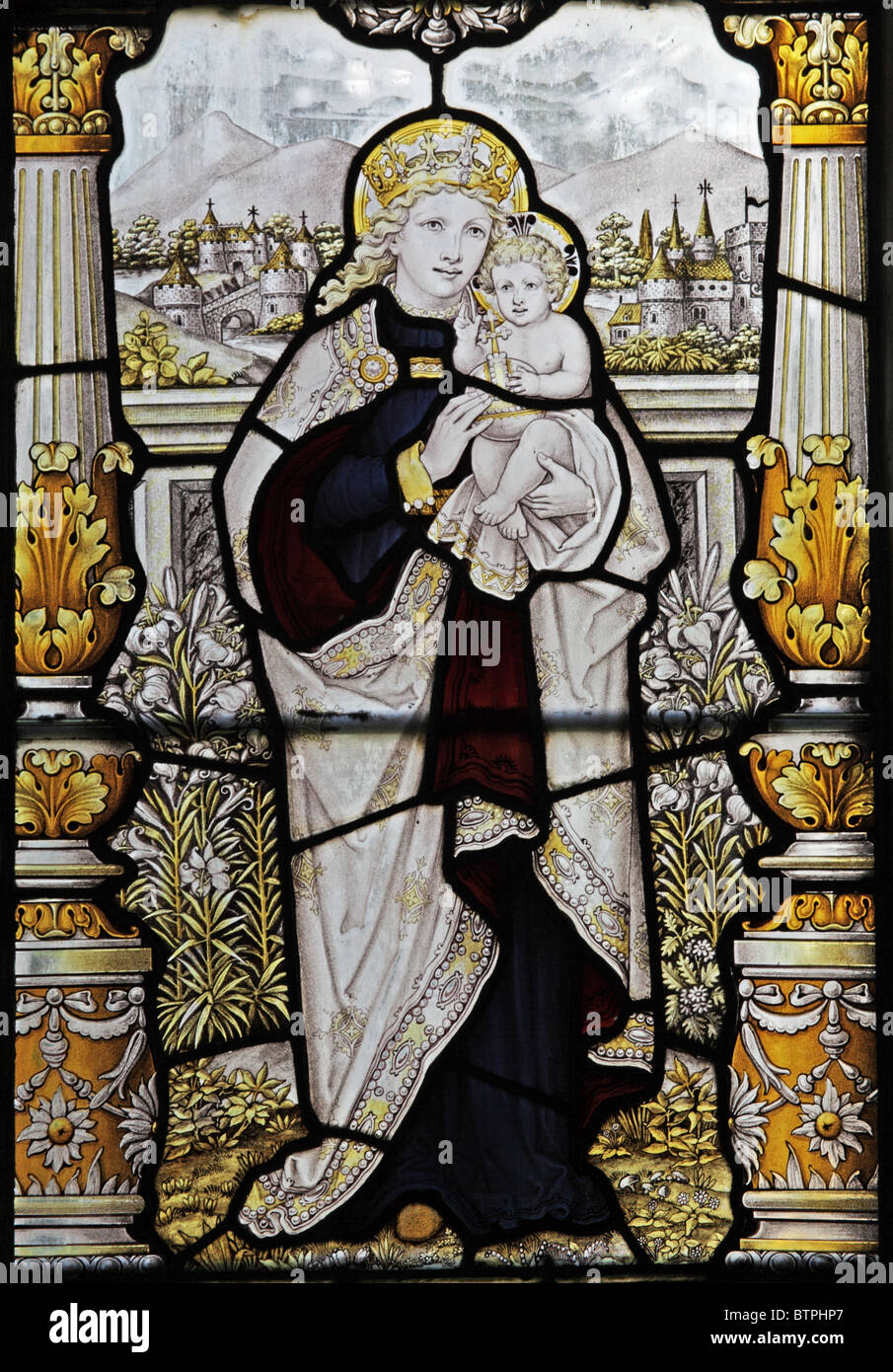 A stained glass window by C E Kempe and Co.depicting The Madonna and Child Stock Photo
