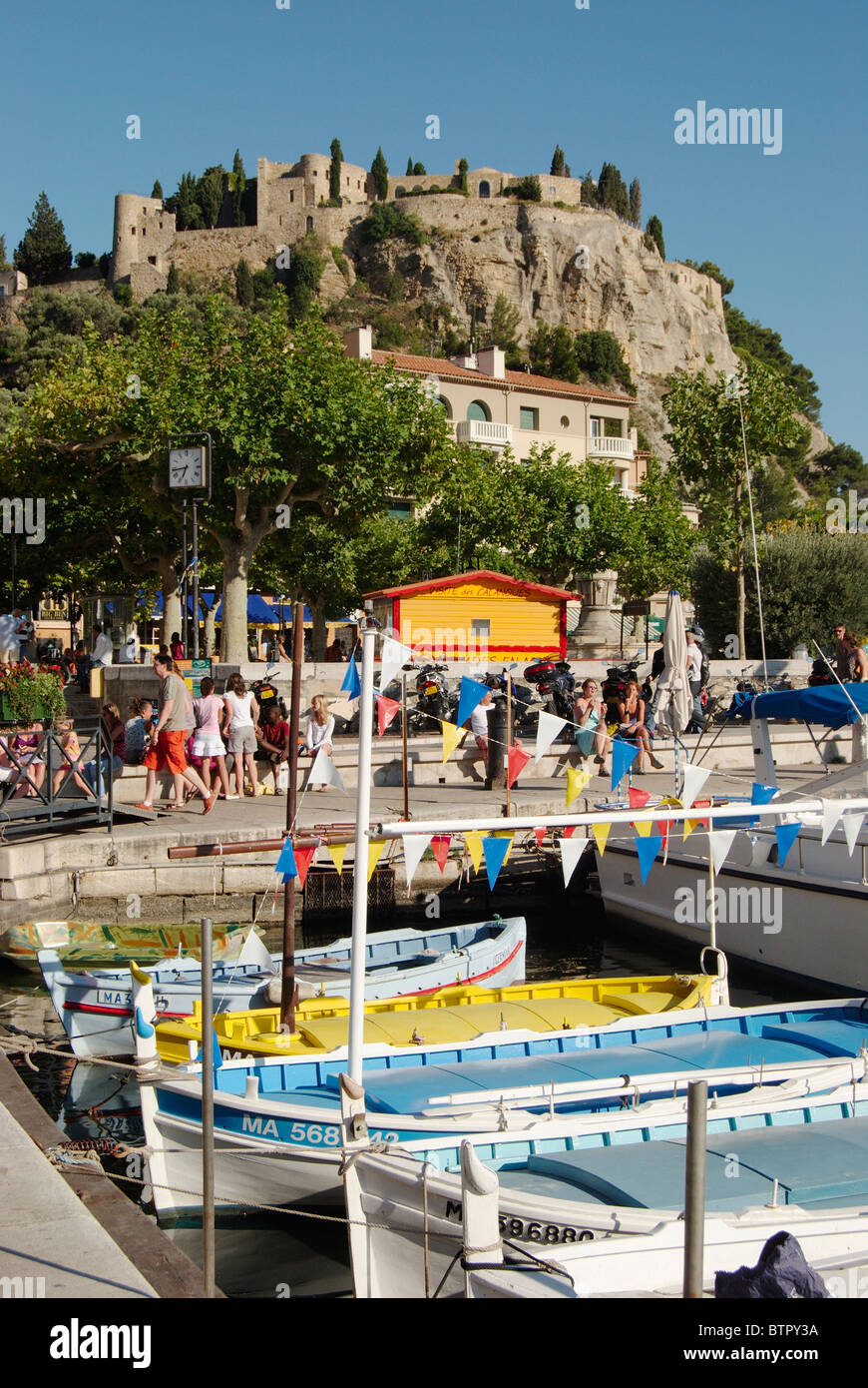 France, Cassis, Vieux Port, Fishing boats with castle on hill in ...