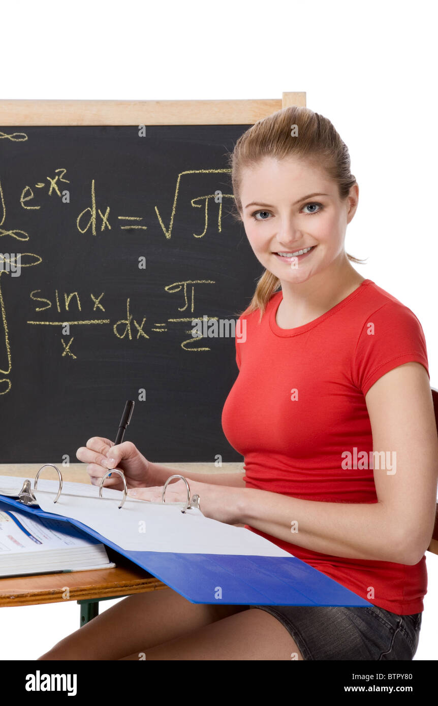 High School Or College Student Sitting By The Desk At Math Class