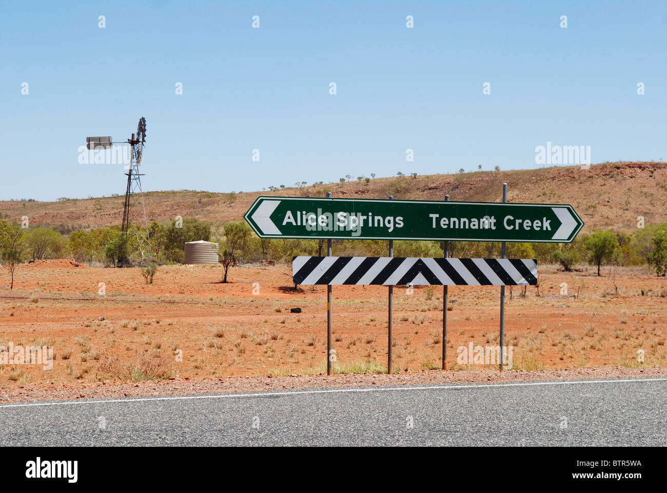Australia, Wind mill and road sign Stock Photo