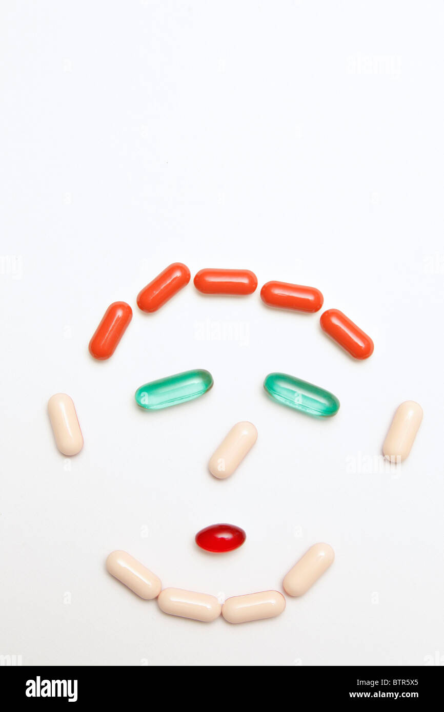 medication and pills face on gray background Stock Photo Alamy