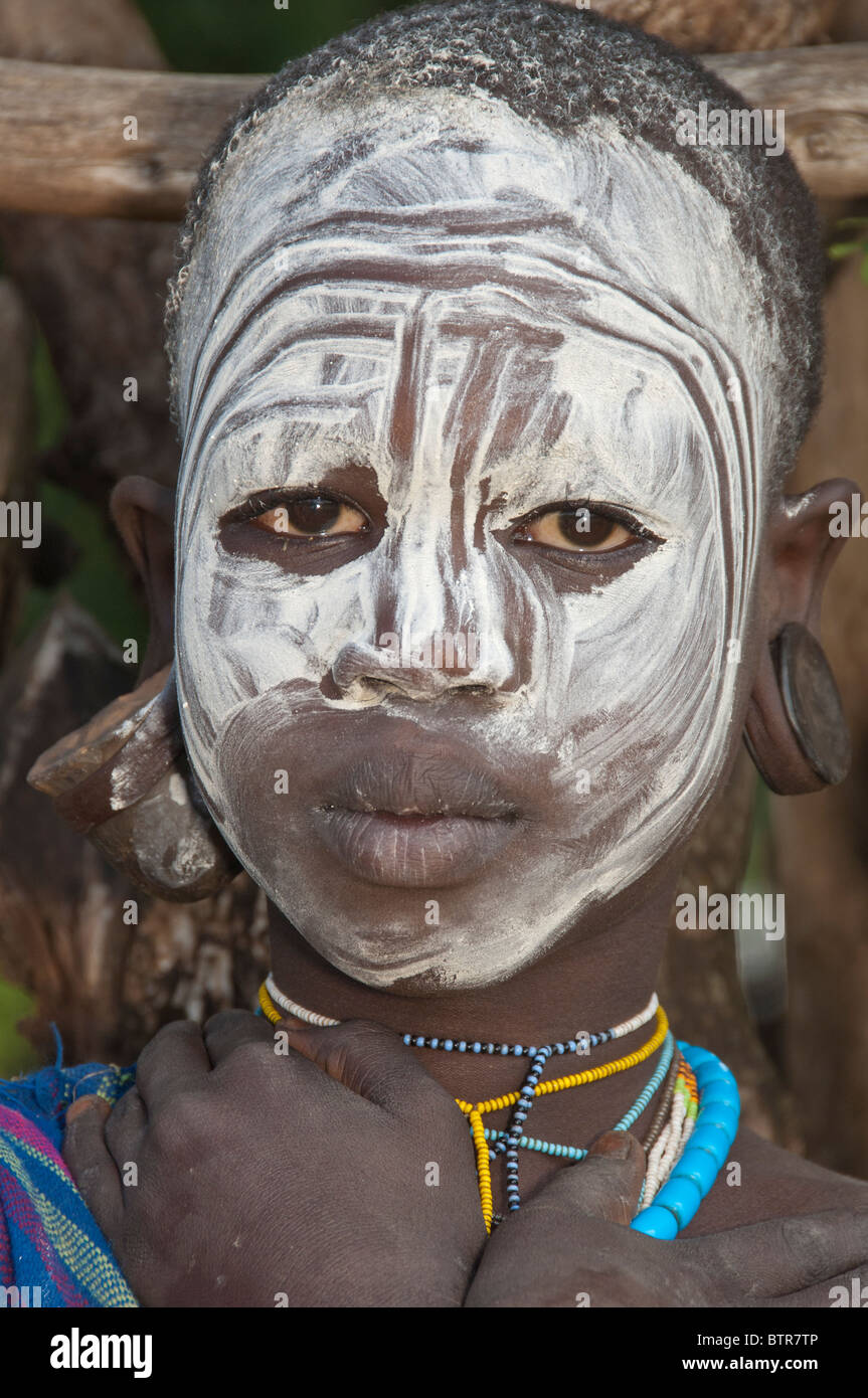 Surma girl with the painted face, Kibish, Omo River Valley, Ethiopia Stock Photo