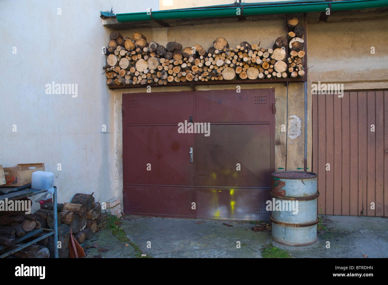 Firewood stored above the garage door Litomerice north Bohemia Czech