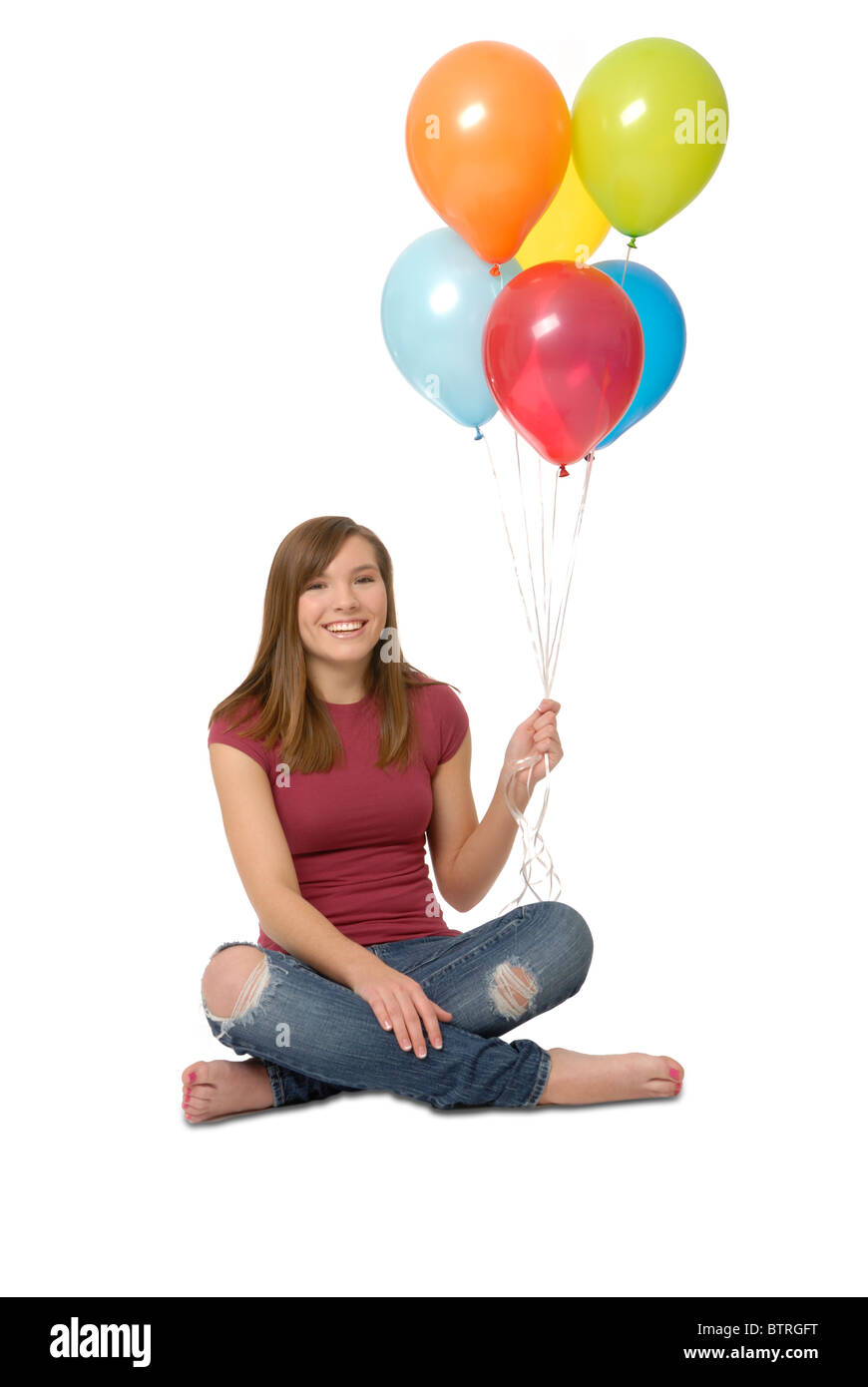 Teenage girl holding balloons Stock Photo Alamy