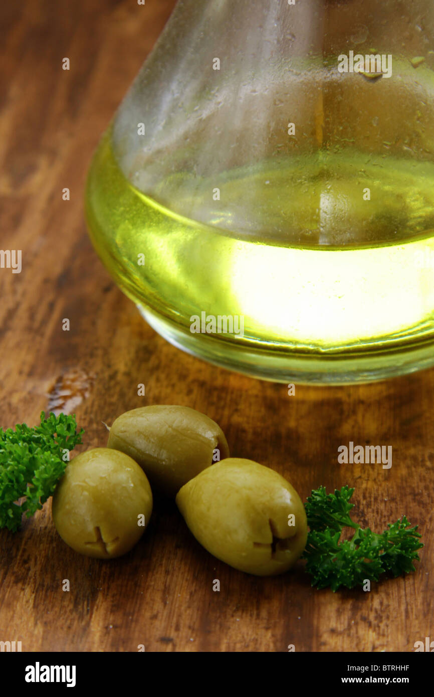 Olive oil and green olives Stock Photo - Alamy