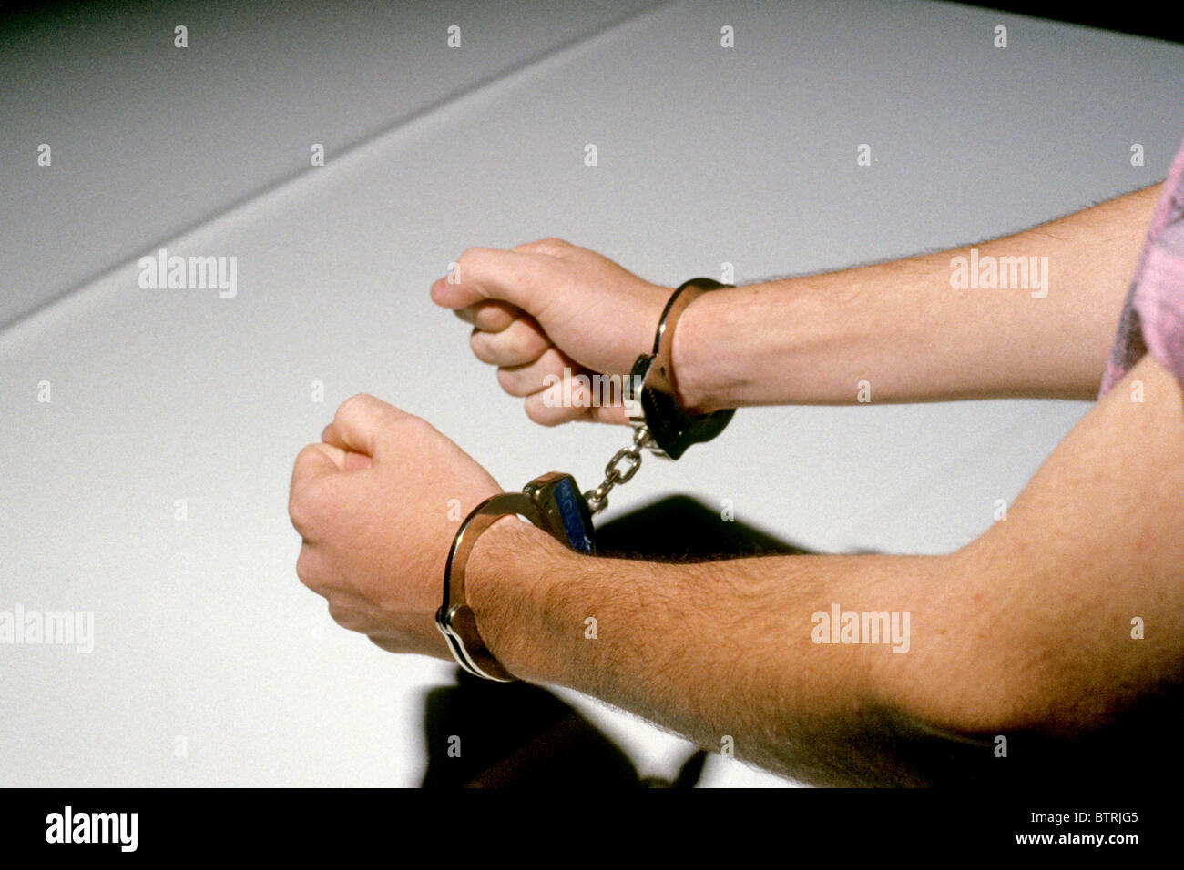 handcuffs hand cuffs arrest law police jail prison restrain lock