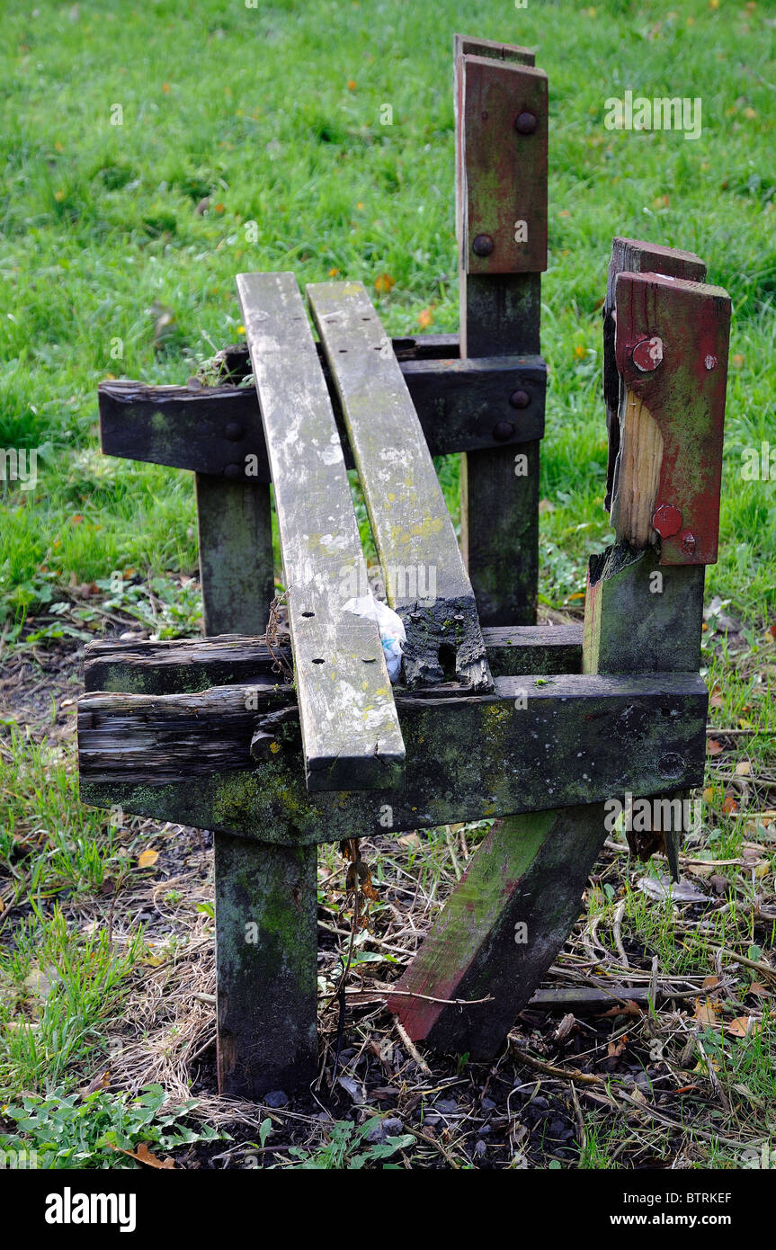 damaged delapidated park bench Stock Photo