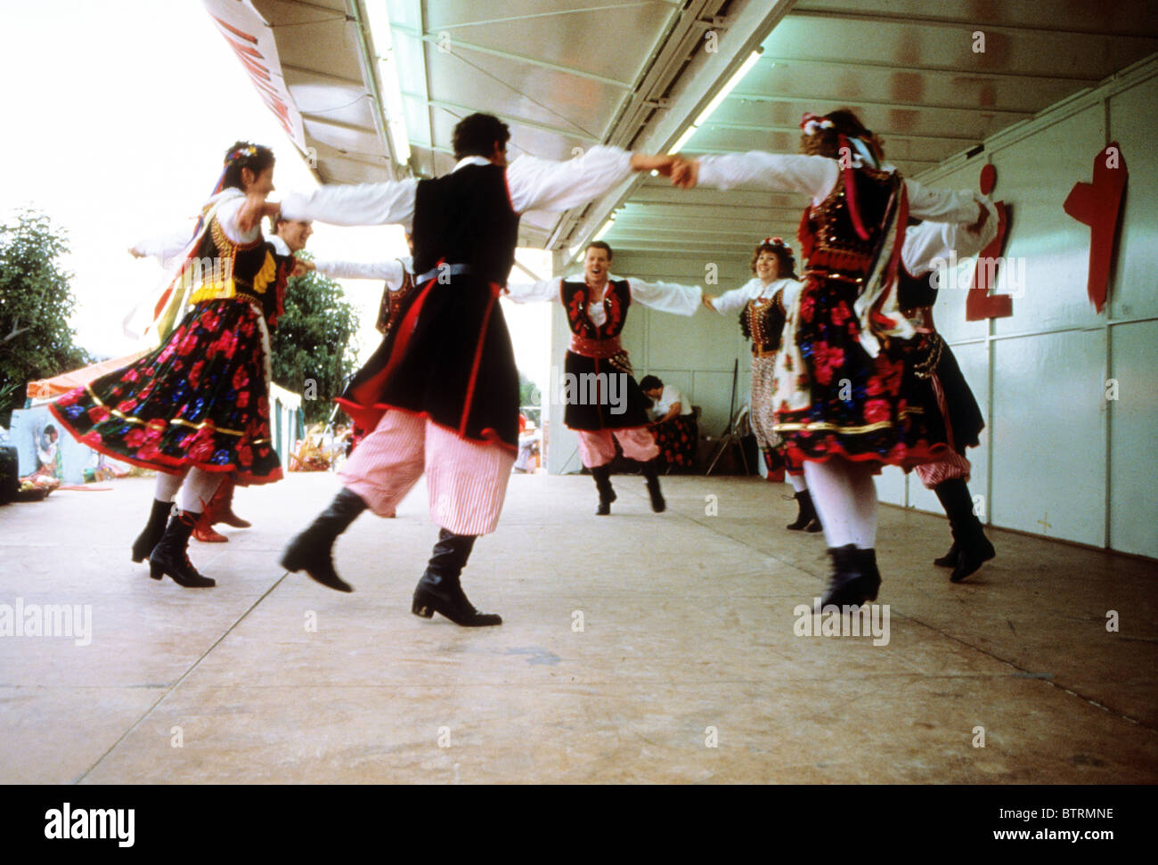 Polish folk dance stage perform culture cultural costume color boot historic exhibit demonstration fair event fiesta carnival Stock Photo