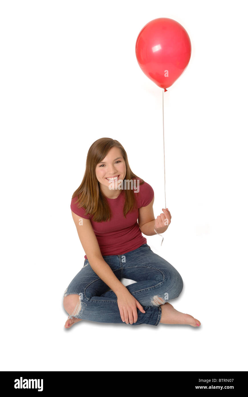 Teenage girl holding balloon. Stock Photo