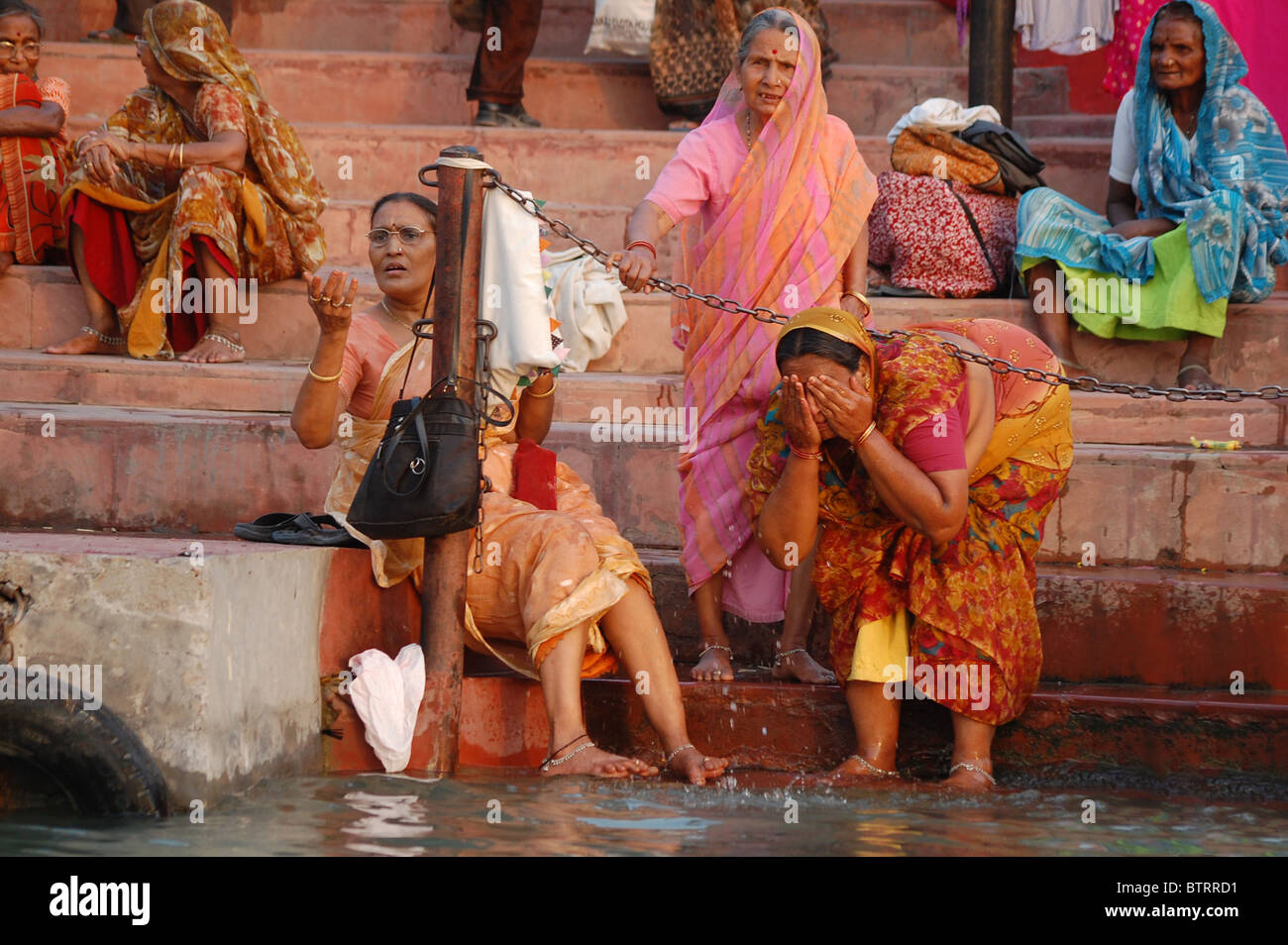 Indian Women Alongside The Ghats On The River Ganges At Kumbha Mela Festival In Haridwar India
