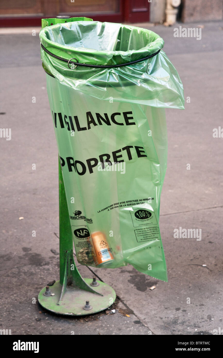 modern French public recycling bin on Paris street with transparent removable bin bag which prevents concealment of explosives Stock Photo