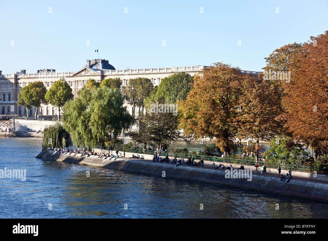 seine-flows-past-relaxed-parisians-sitting-on-quai-of-square-du-vert