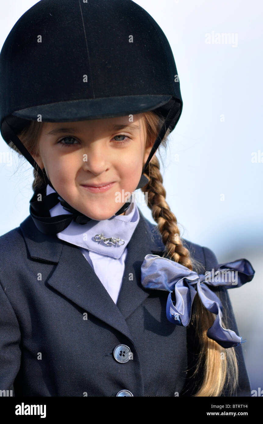 young girl in equestrian outfit Stock Photo