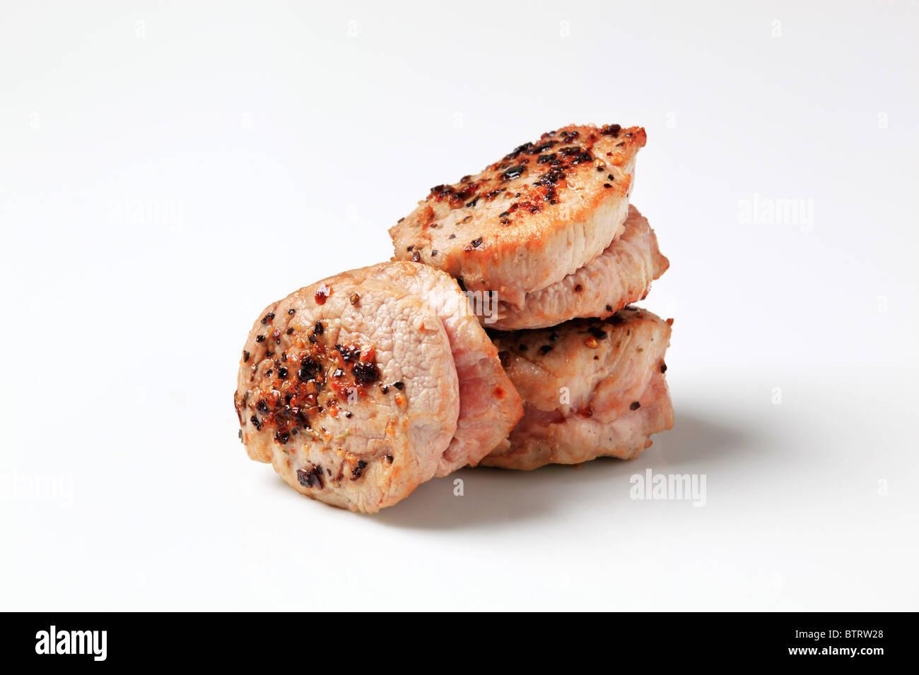 Roast pork filet mignons seasoned on top Stock Photo