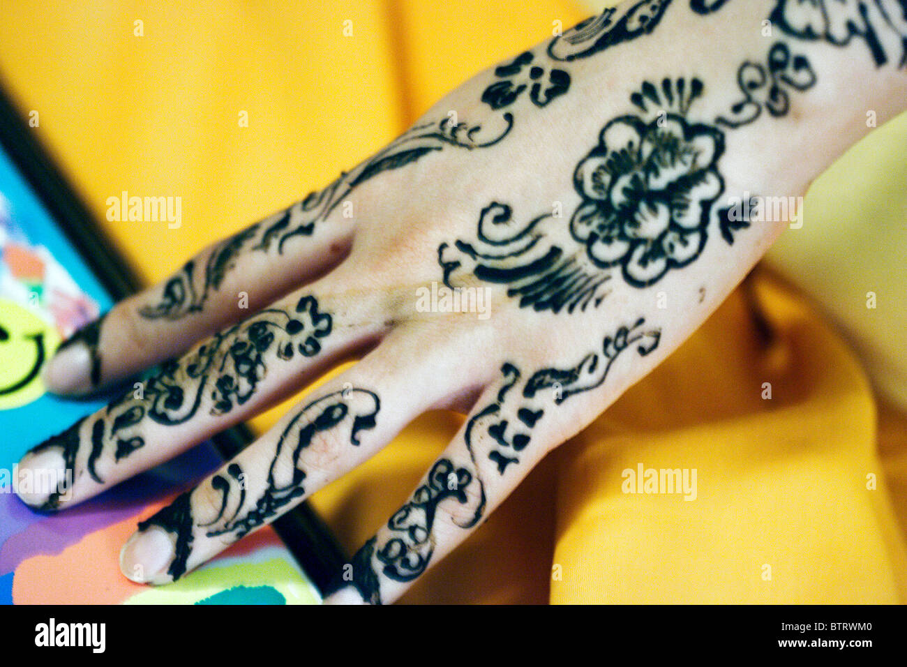 Young Muslim bride-to-be has elaborate henna designs painted on her ...