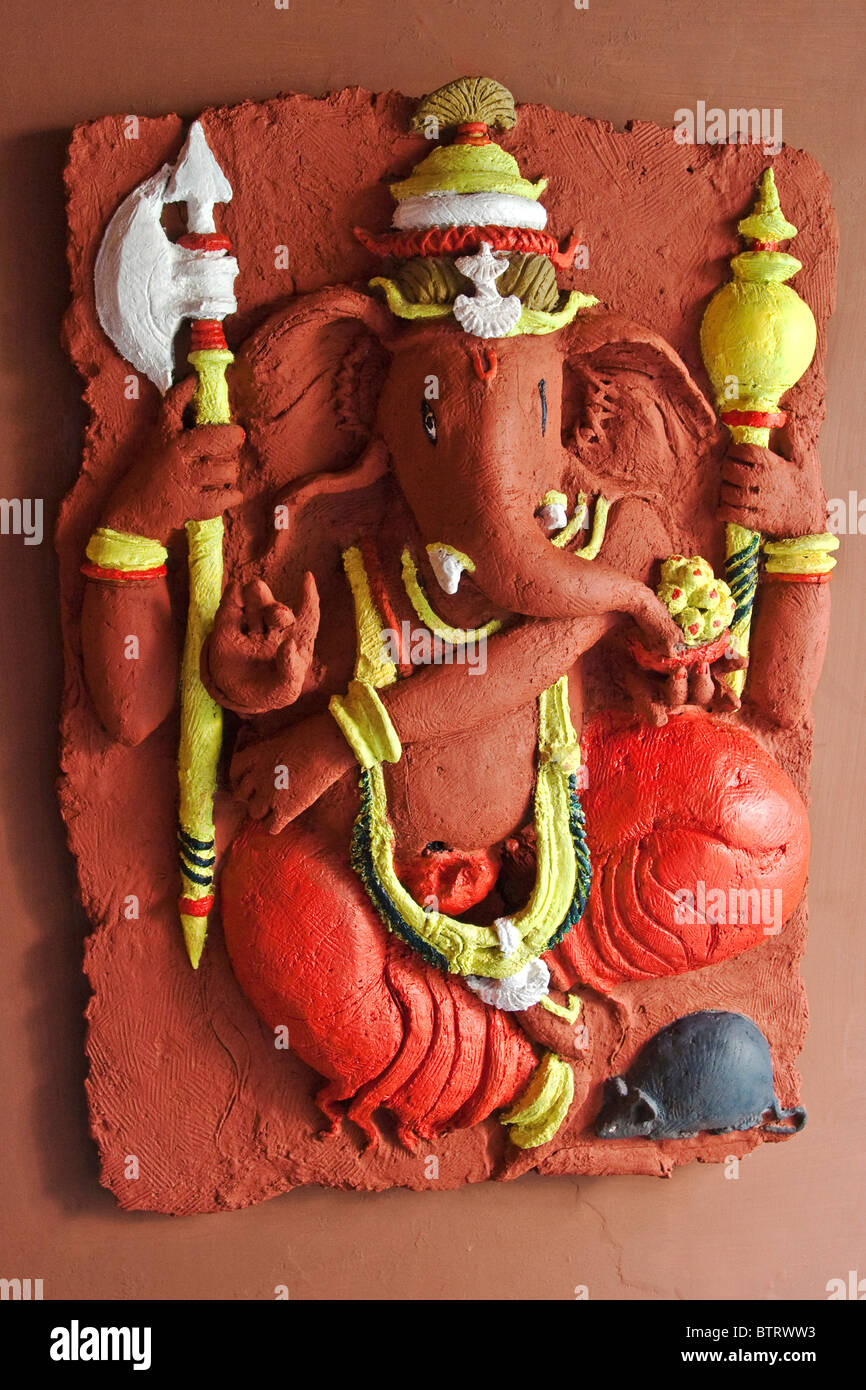 Painted Statue of Lord Ganesh, an Indian God, attached to a wall. Ahmedabad City, Gujarat State, India. Stock Photo
