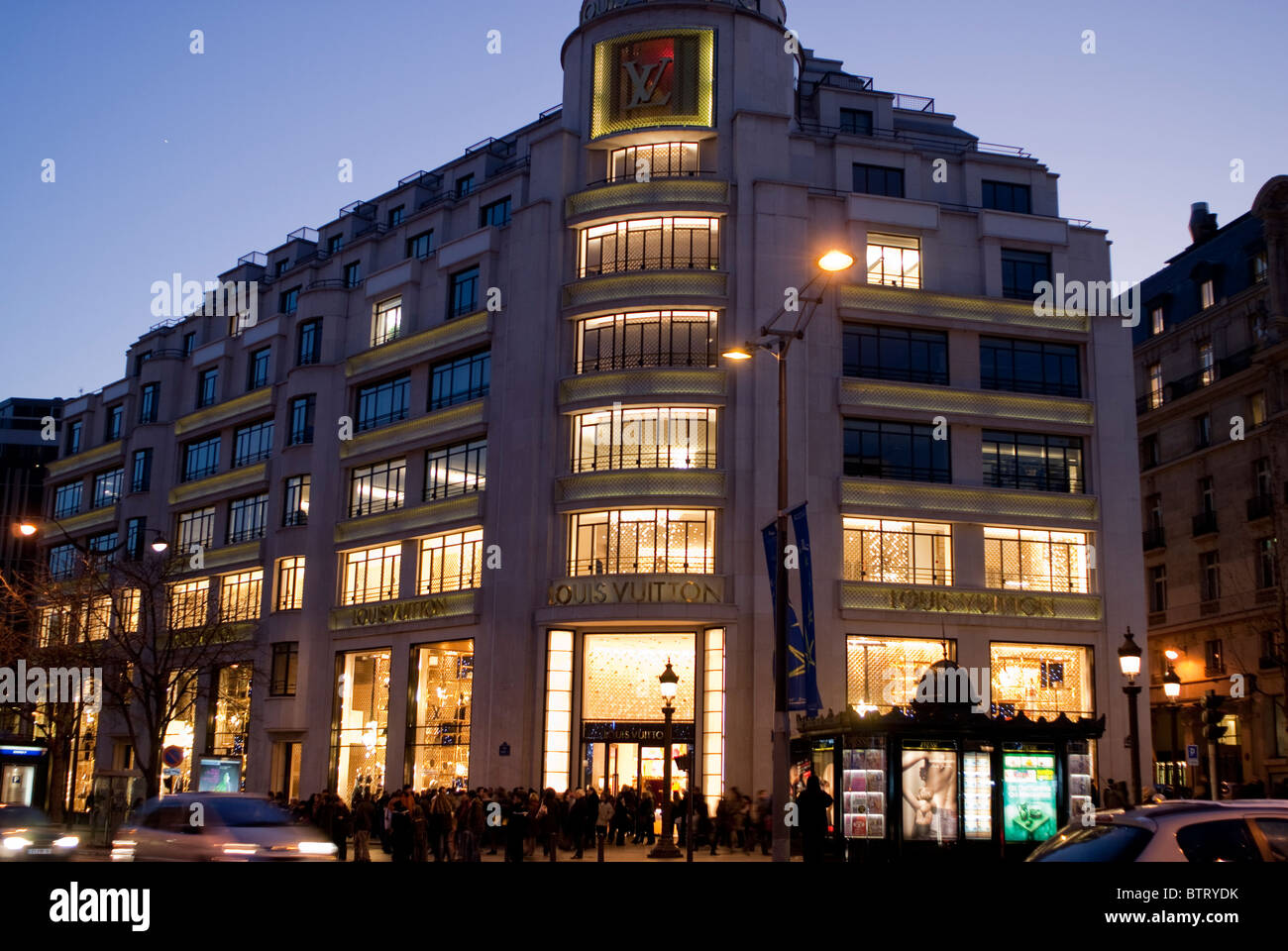 Paris, France, Art Deco Office Building and LVMH Store on Avenue Champs-Elysees, at Dusk, Luxury Fashion Brands, louis vuitton store Stock Photo