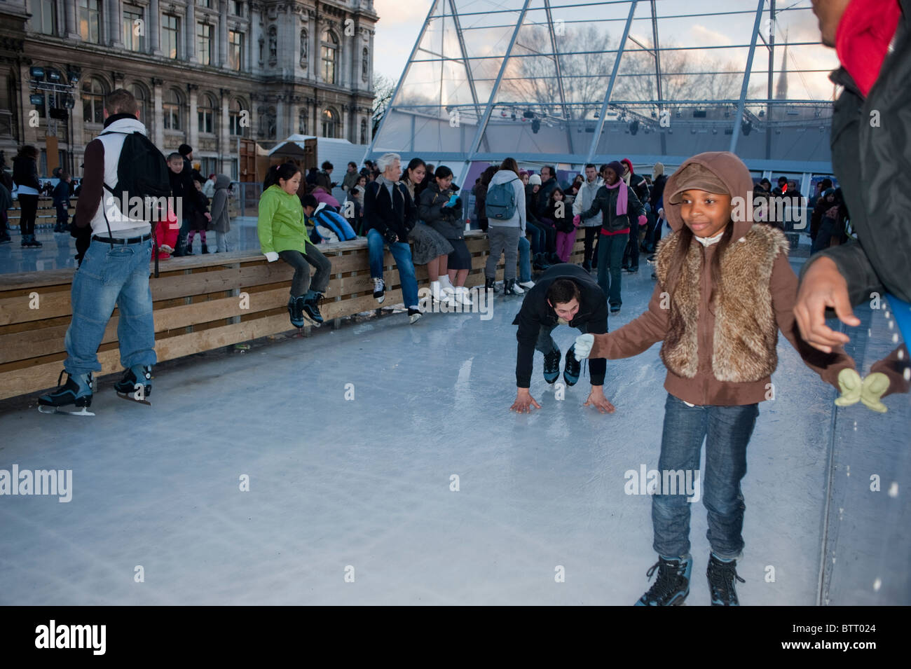 Crowd of Children, Ice Skaters, Enjoying Ice Skating Rink Paris, France