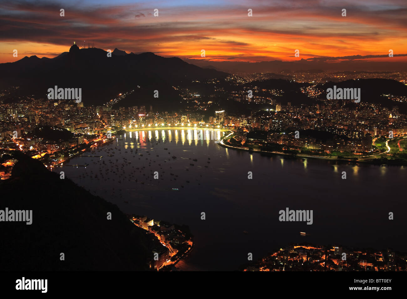 Night, evening view from sugar loaf mountain of Rio de janerio bay as sun sets over the city Stock Photo