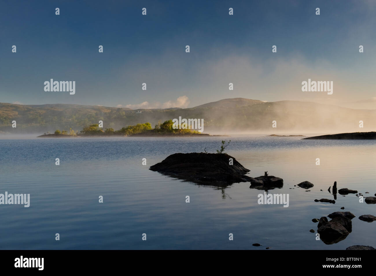 Dawn on a misty morning near Doon Rocks, on the north-western shore of Lough Corrib, Co Galway, Ireland Stock Photo