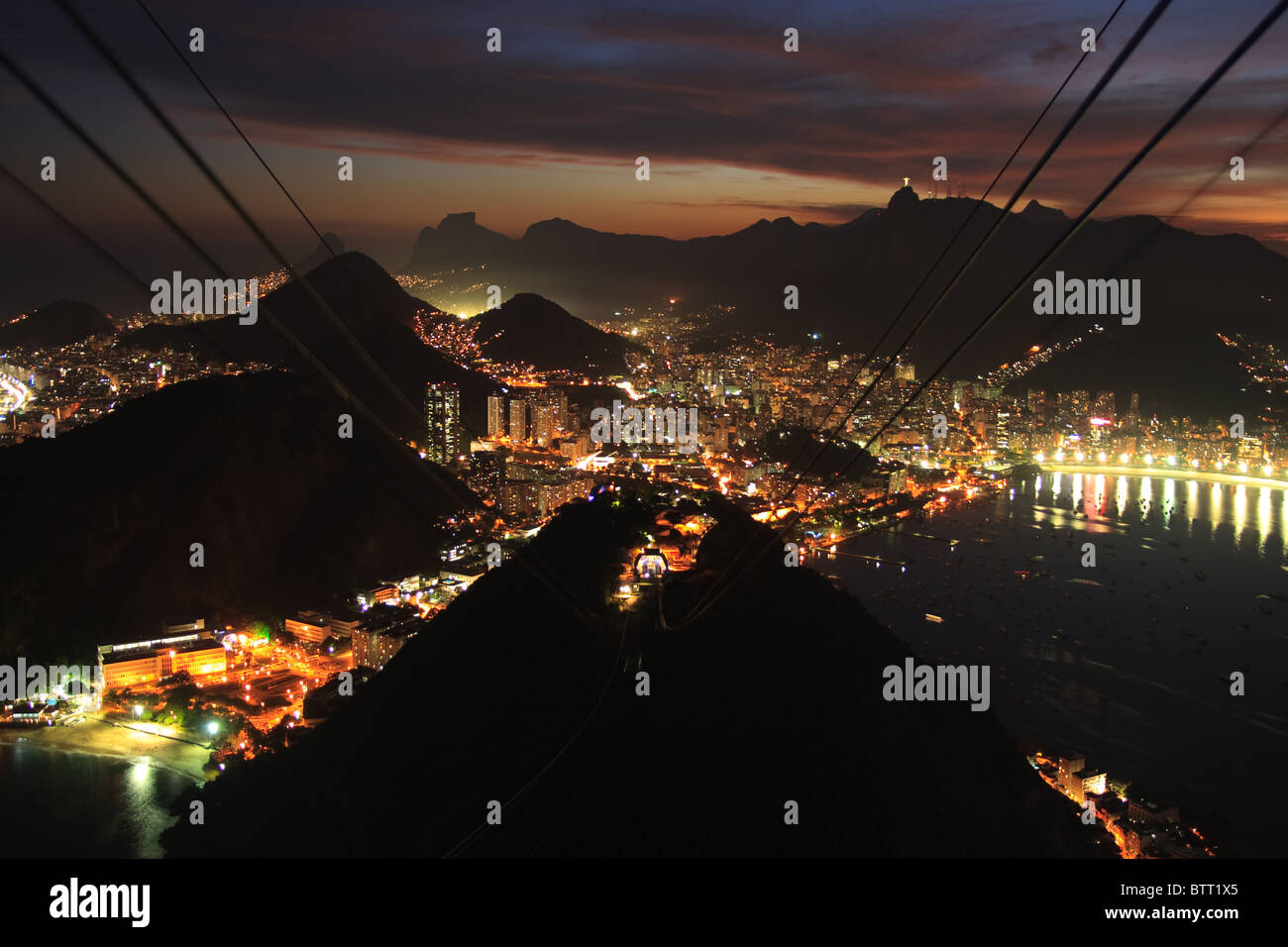 Night, evening view from sugar loaf mountain of Rio de janerio bay as sun sets over the city Stock Photo