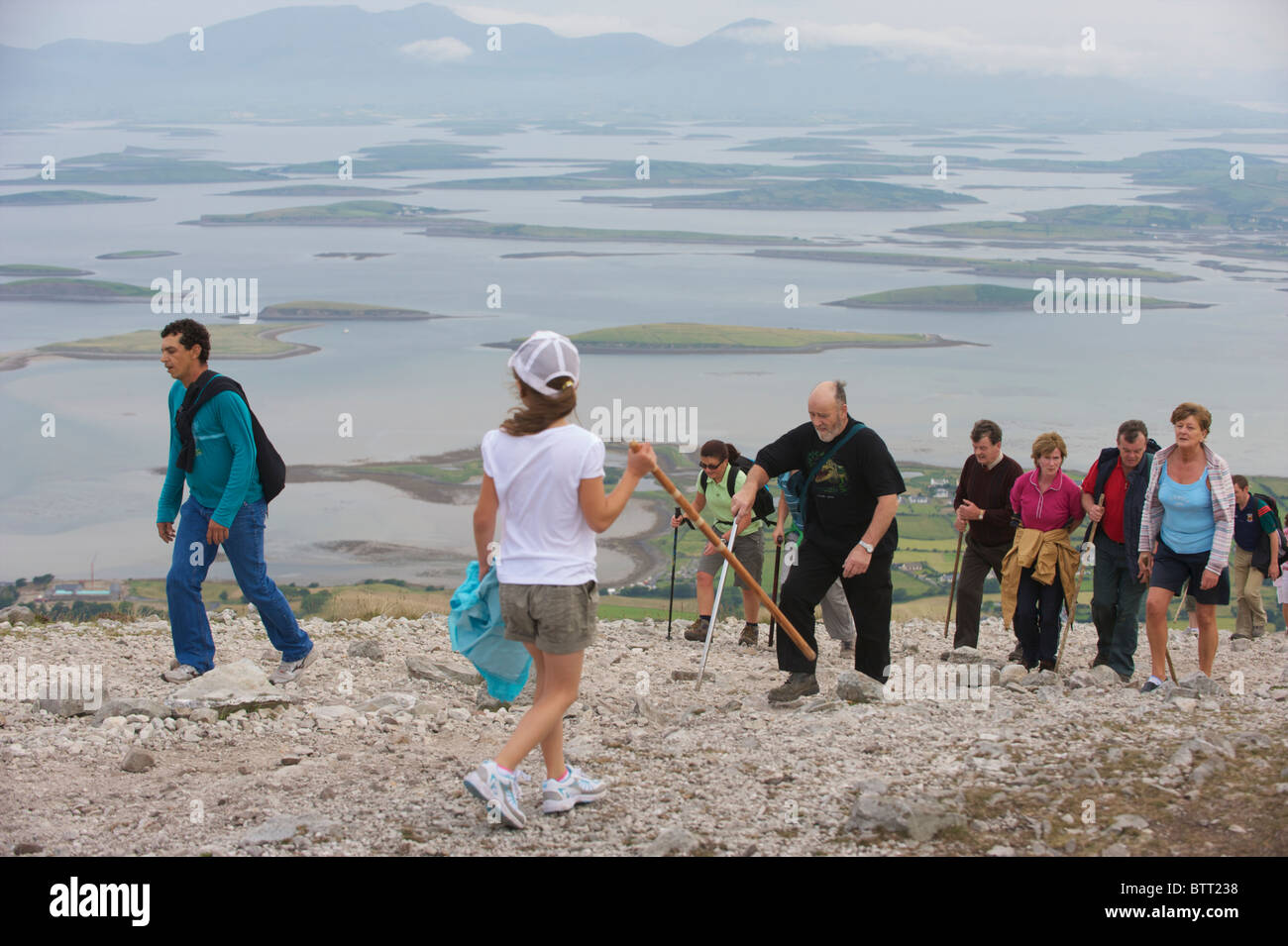 People climbing Croagh Patrick a holy mountain in County Mayo, Ireland