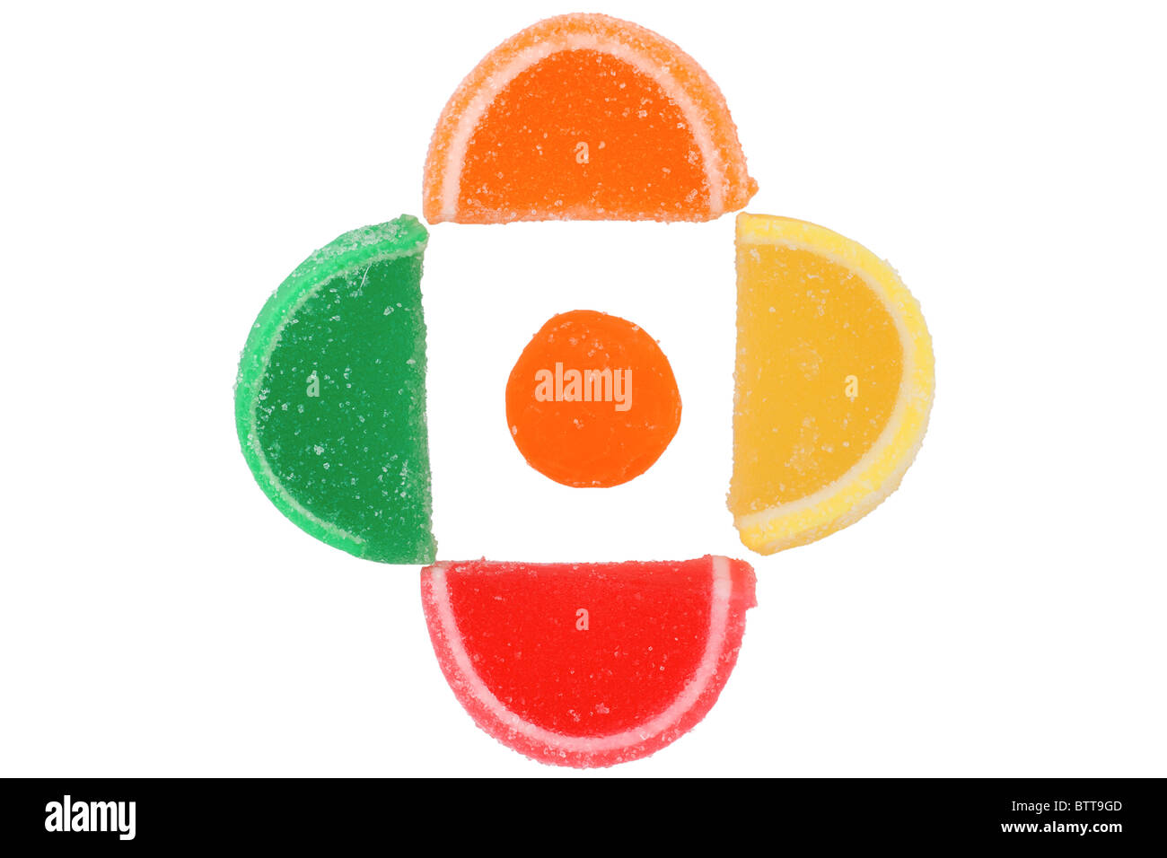 Sweet fruit colored jelly slices isolated on white background. Stock Photo
