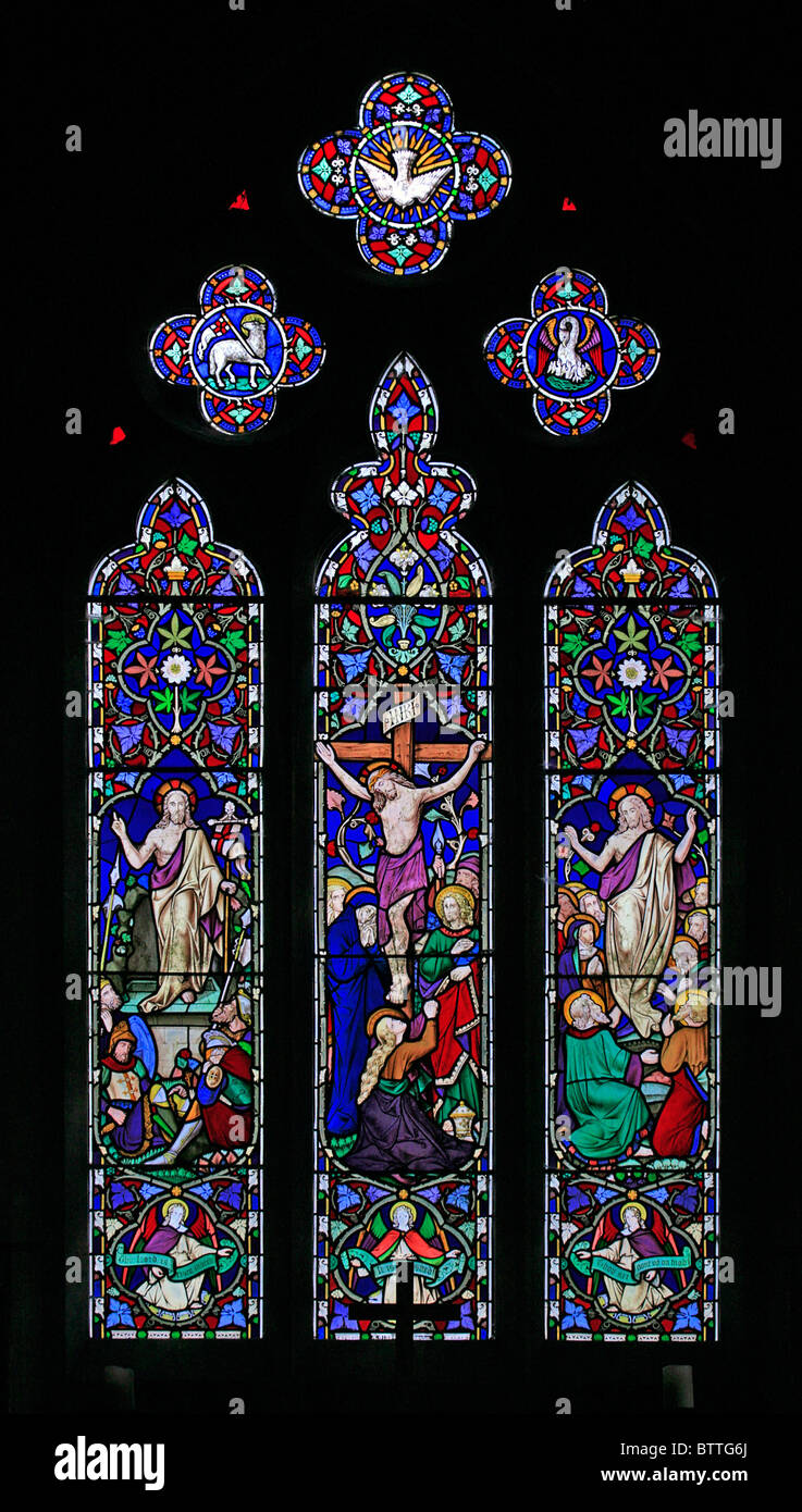 A stained glass window depicting The Crucifixion, Resurrection and Ascension, Church of St James the Great, Bratton, Wiltshire Stock Photo