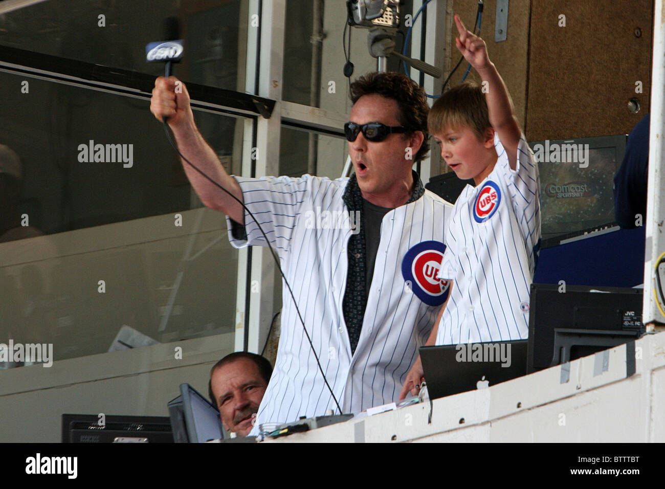 John Cusack Sings During 7th Inning Stretch at Chicago Cubs Baseball