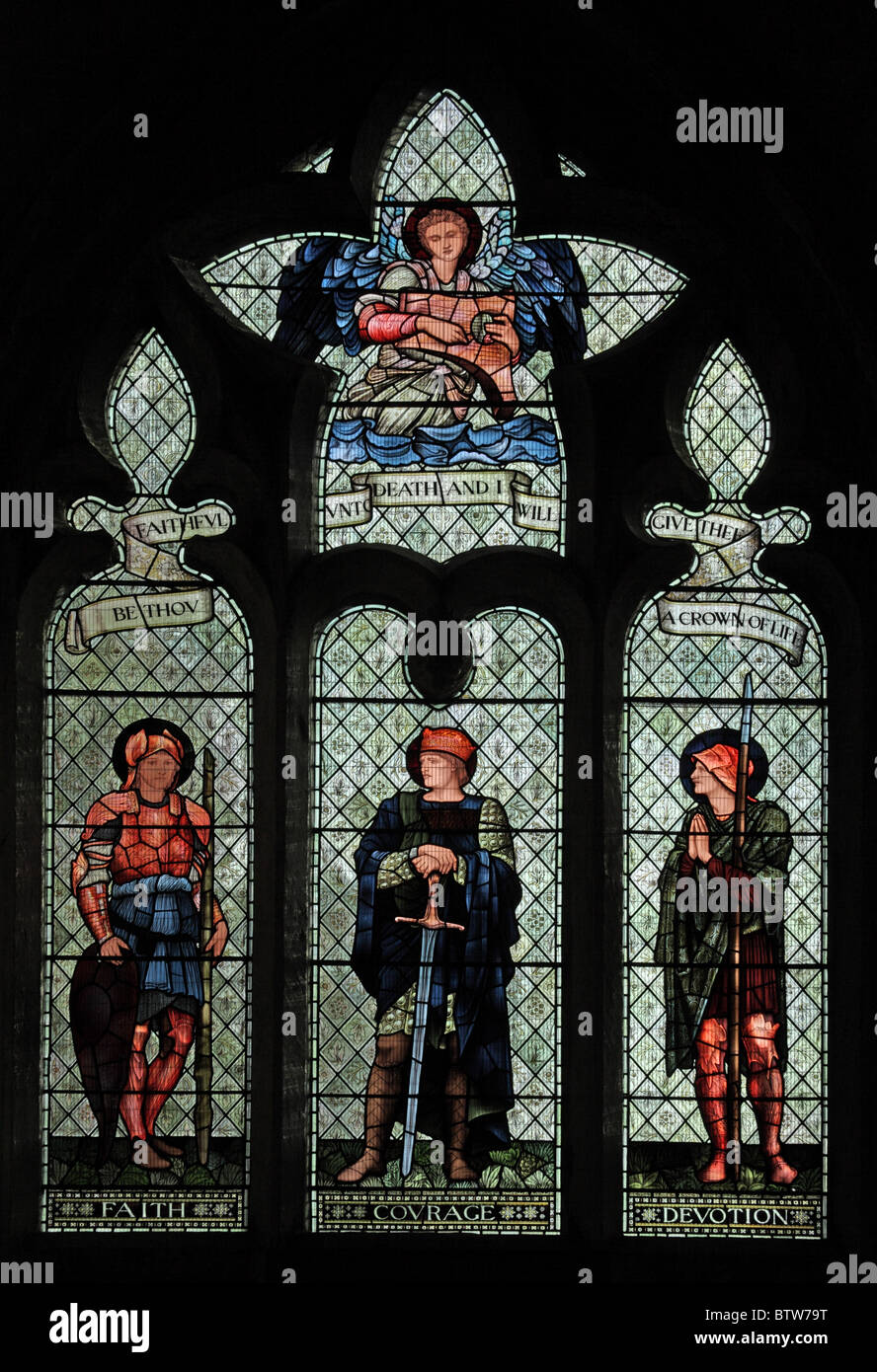 A stained glass window by Edward Burne-Jones depicting Faith, Courage and Devotion, Malmesbury Abbey, Wiltshire Stock Photo
