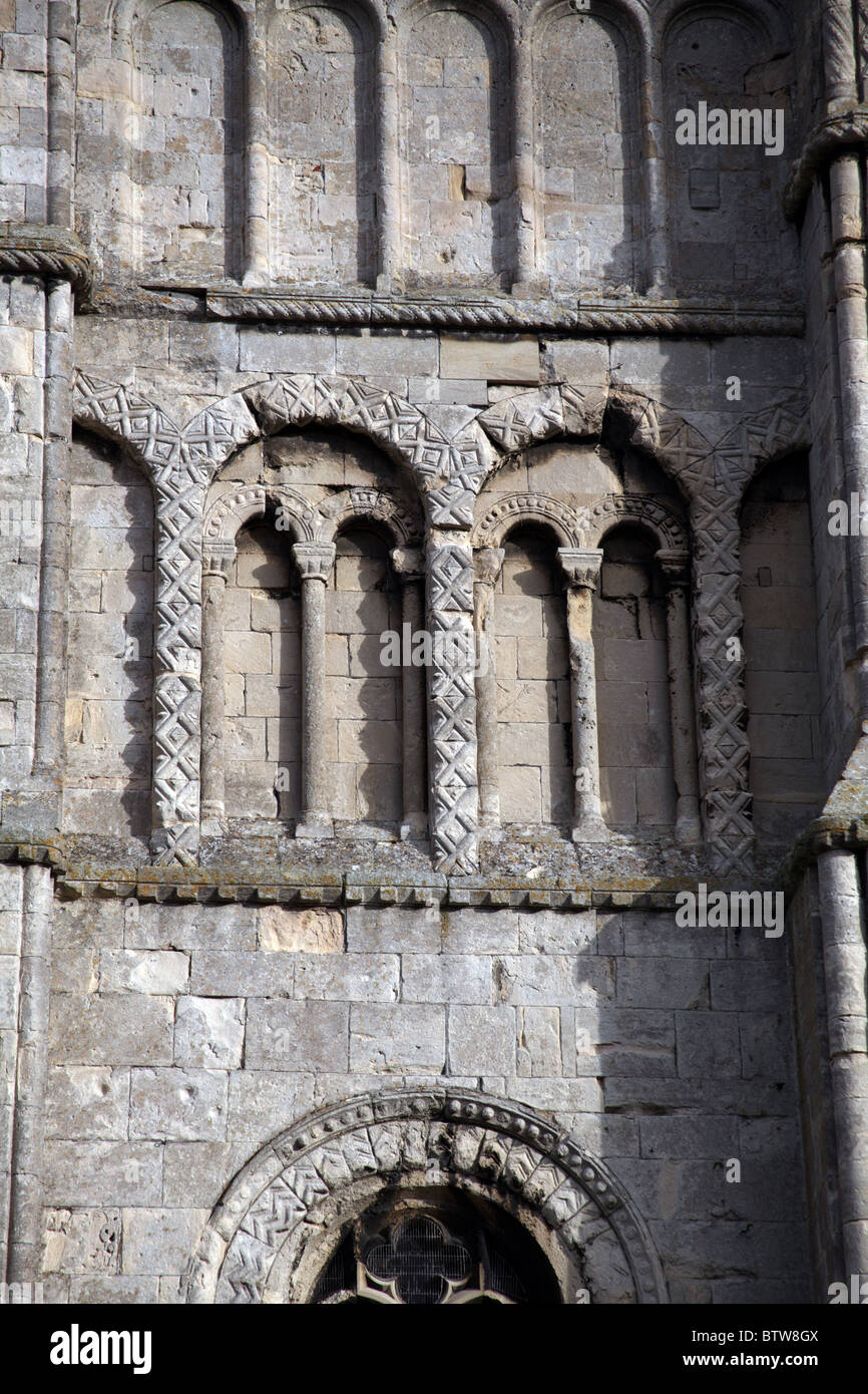 12th century Norman blind arches with diaper carving details on the tower Malmesbury Abbey, Wiltshire Stock Photo