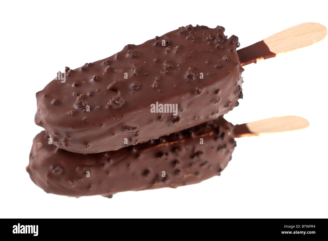 Two dark chocolate covered biscuit ice cream lollies with on sticks