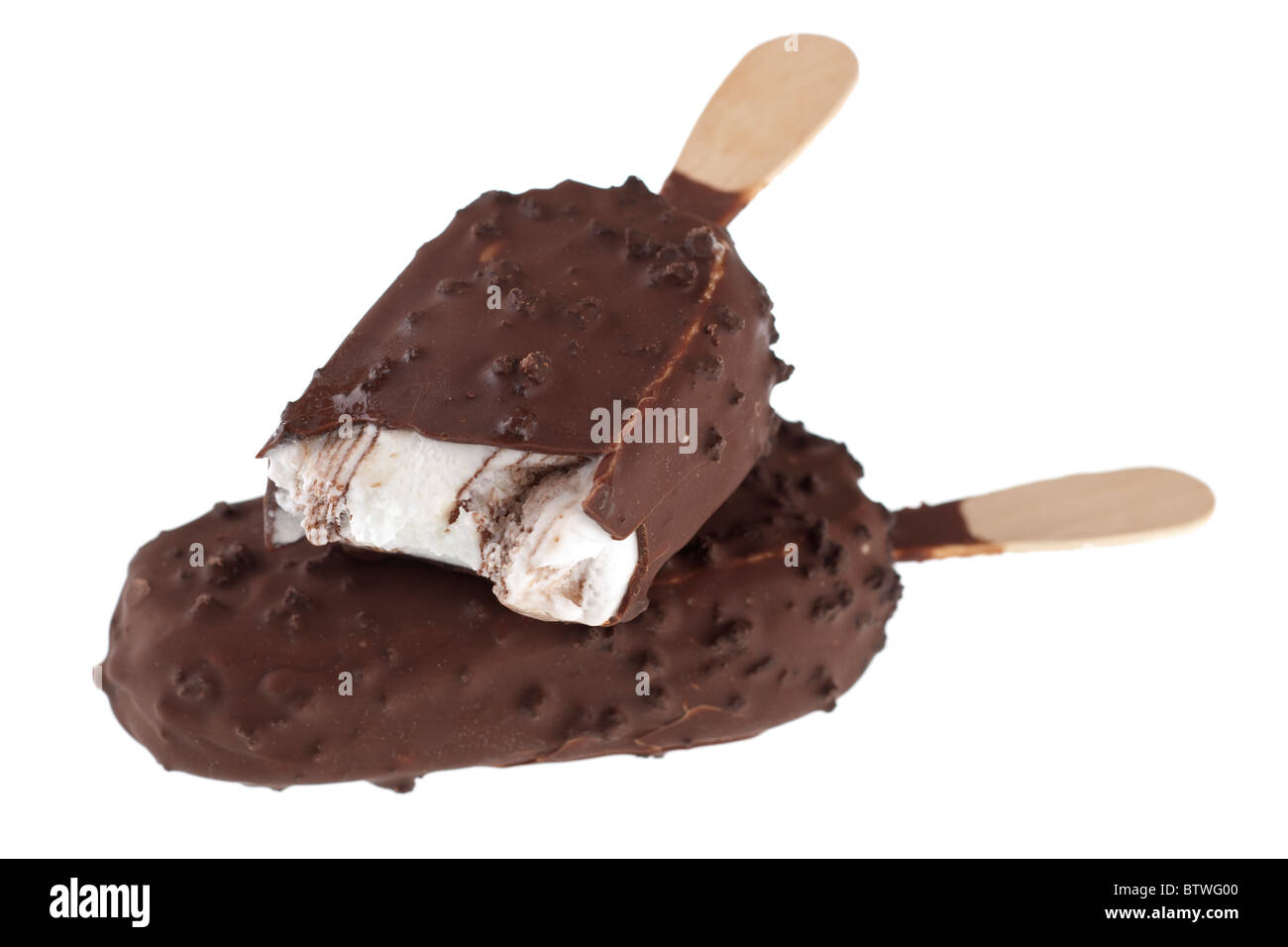 Two dark chocolate covered biscuit ice cream lollies with on sticks Stock Photo