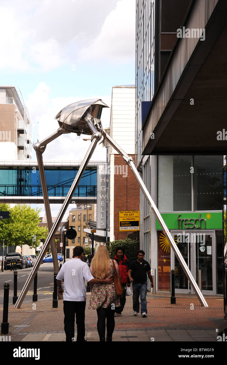 Woking commemorates writer H G Wells with a statue of a Martian fighting machine in the town centre. Stock Photo