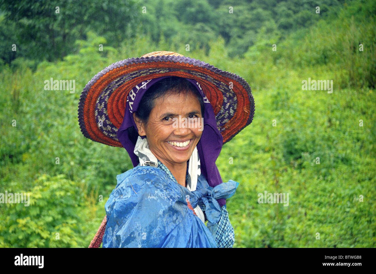 A smiling woman with her straw hat Thailand Stock Photo - Alamy