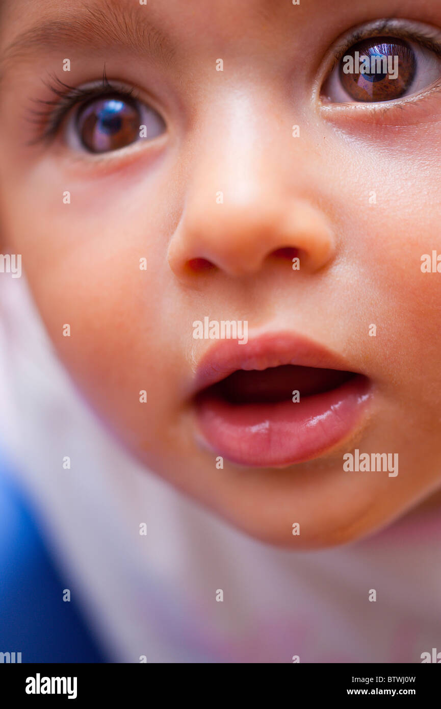 Female child looking up in wonder Stock Photo
