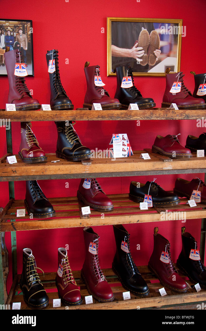 Cherry Red and Black Dr.Martens boots on a rack for sale. Photo:Jeff  Gilbert Stock Photo - Alamy