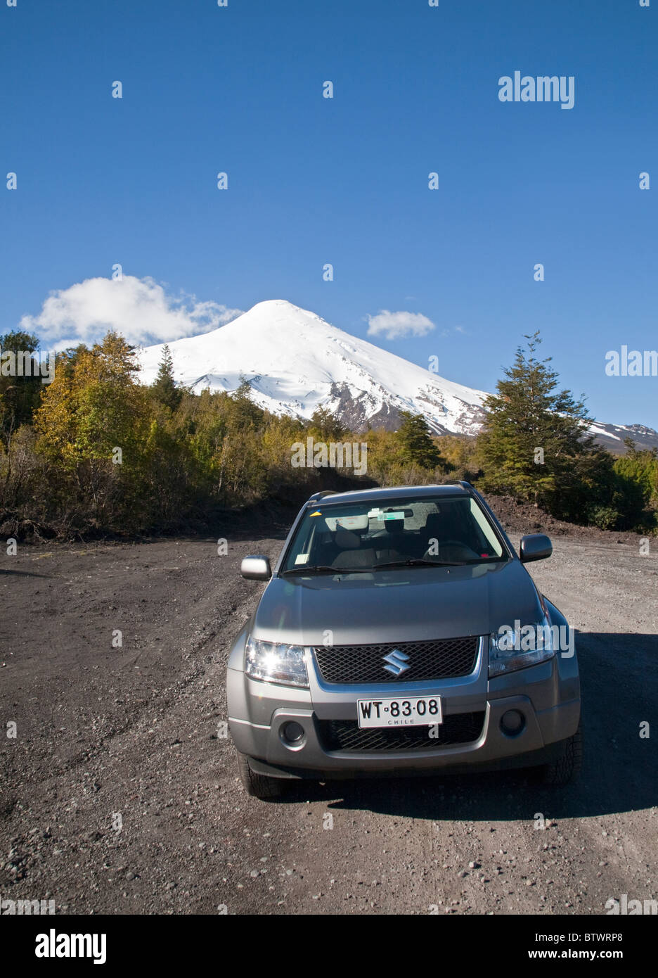 Suzuki Car on Dirt Road leading to foot of Volcano Osorno, near Puerto Varas, Chile Stock Photo