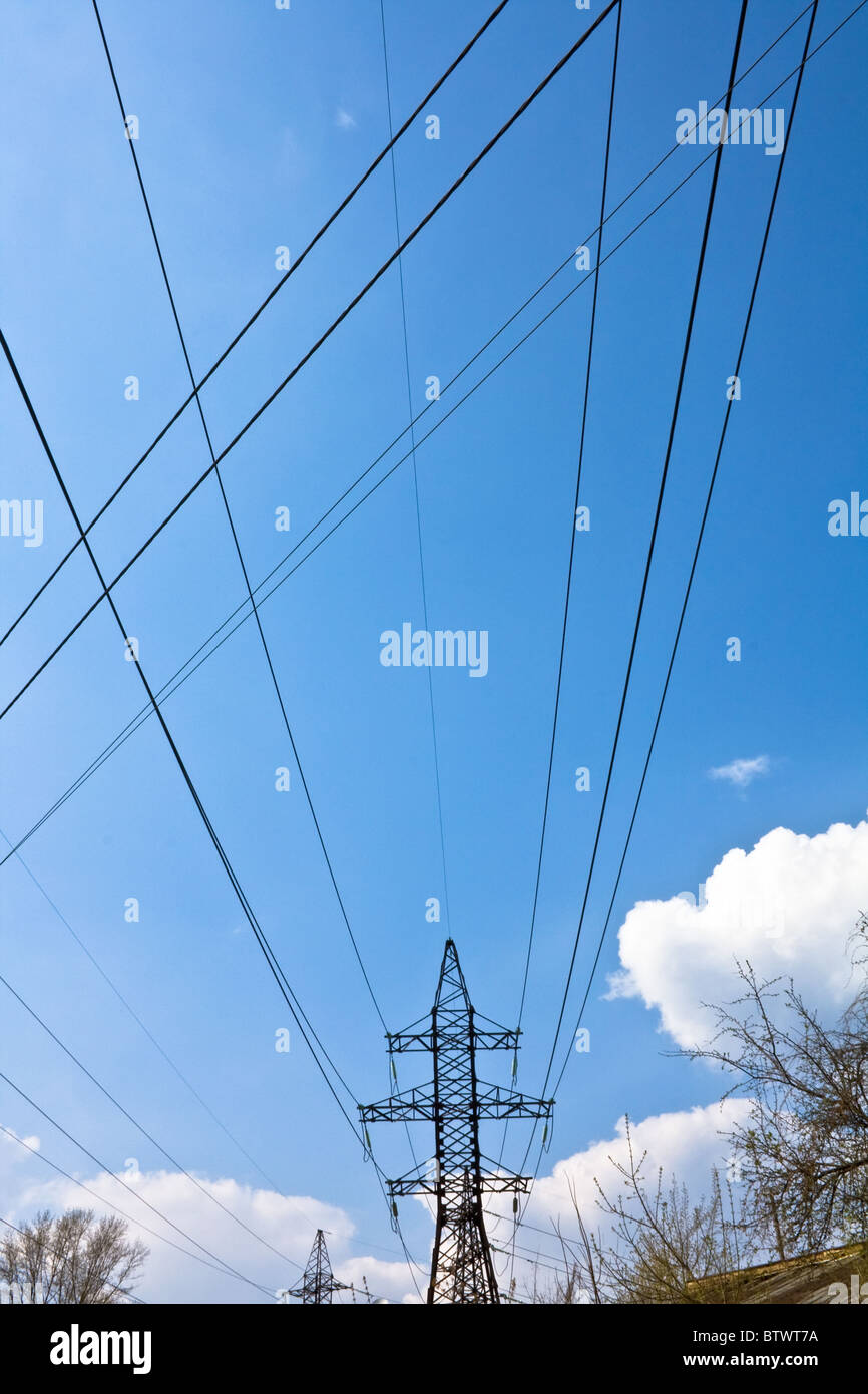 High voltage electric power transmission line pylon and wires in front ...